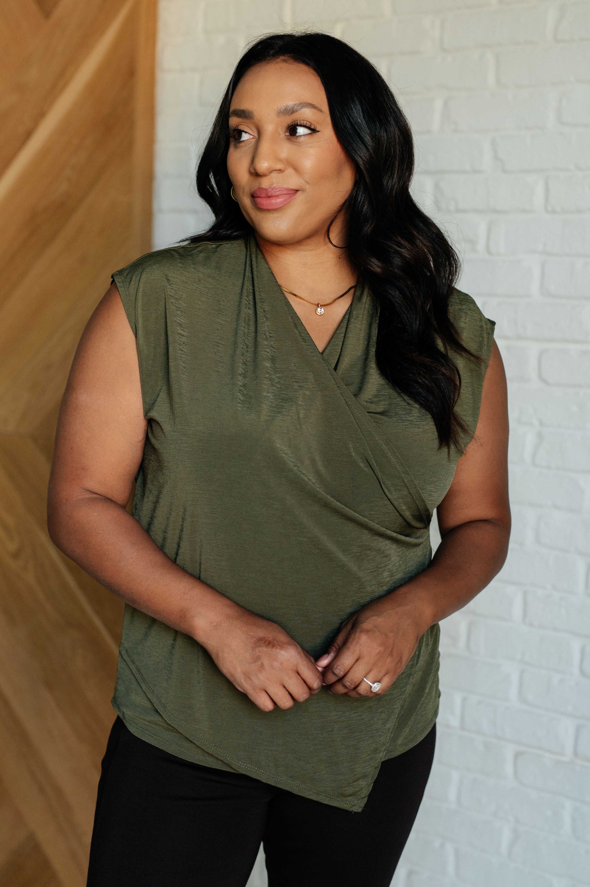 Classic Surplice Front Top in Olive featuring a chic neckline and asymmetrical hemline, made from high stretch Bulgari fabric.