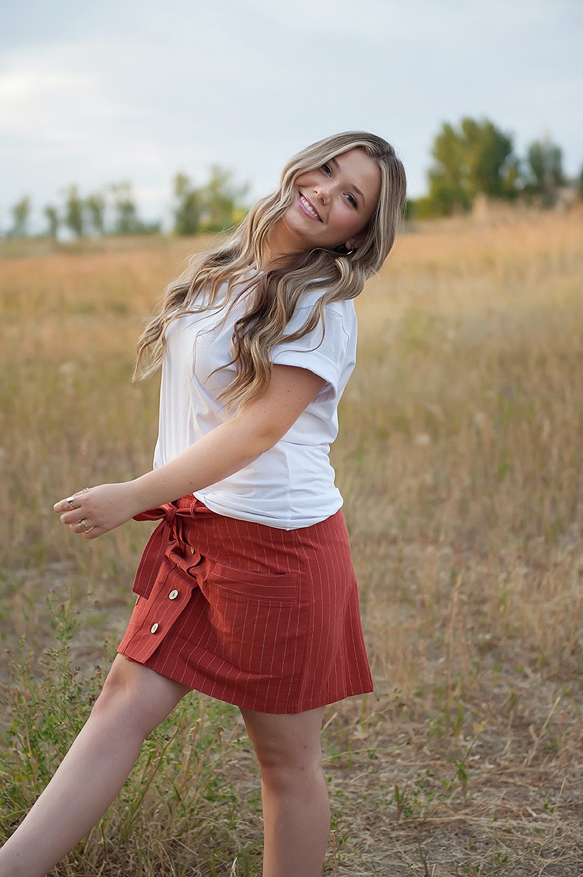 Coconut button stripe woven skirt in rust color with white stripes and a belt, featuring functional accent pockets.