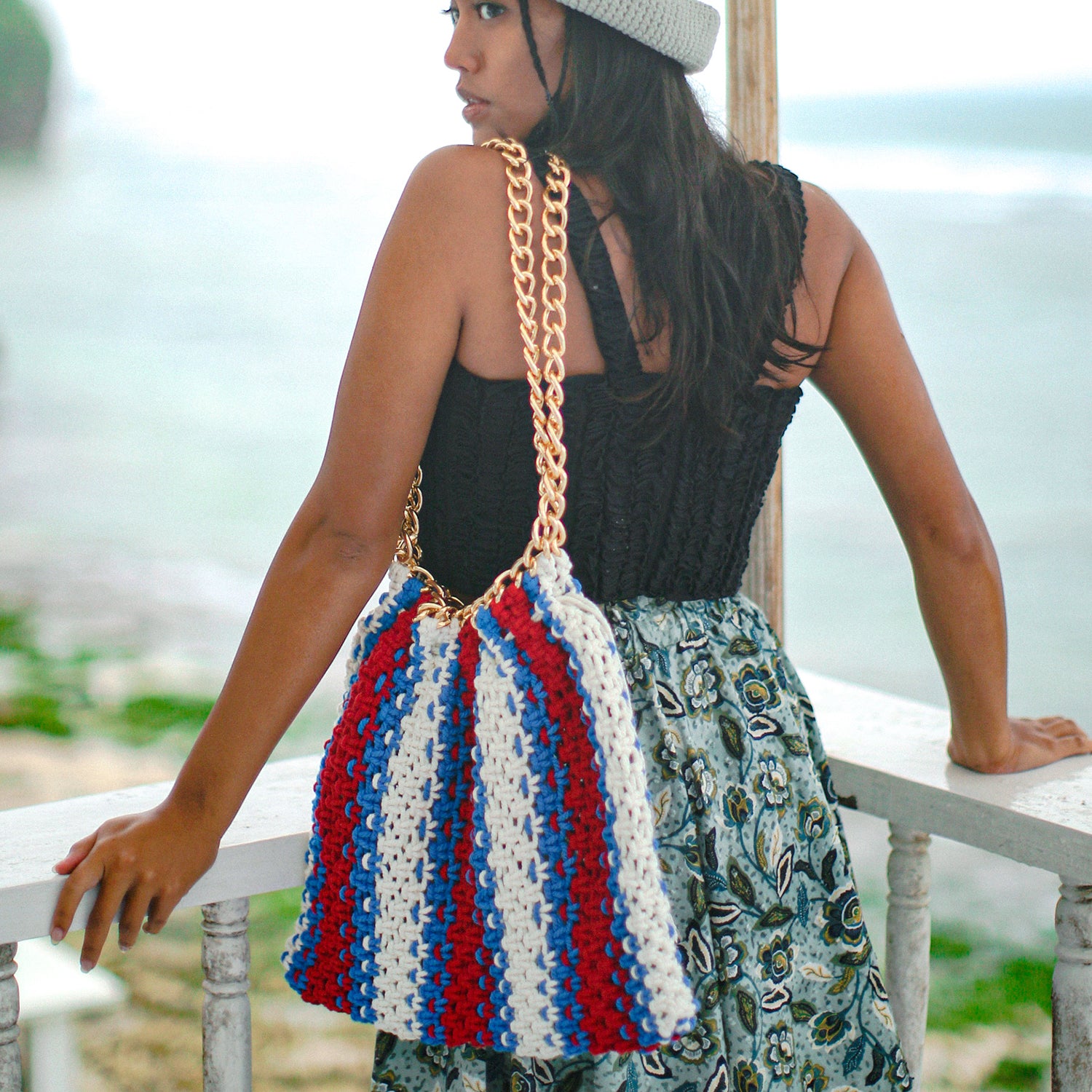 COLETTE Macrame Beach Bag in red, white, and blue with chain straps and tassels, perfect for beach outings.