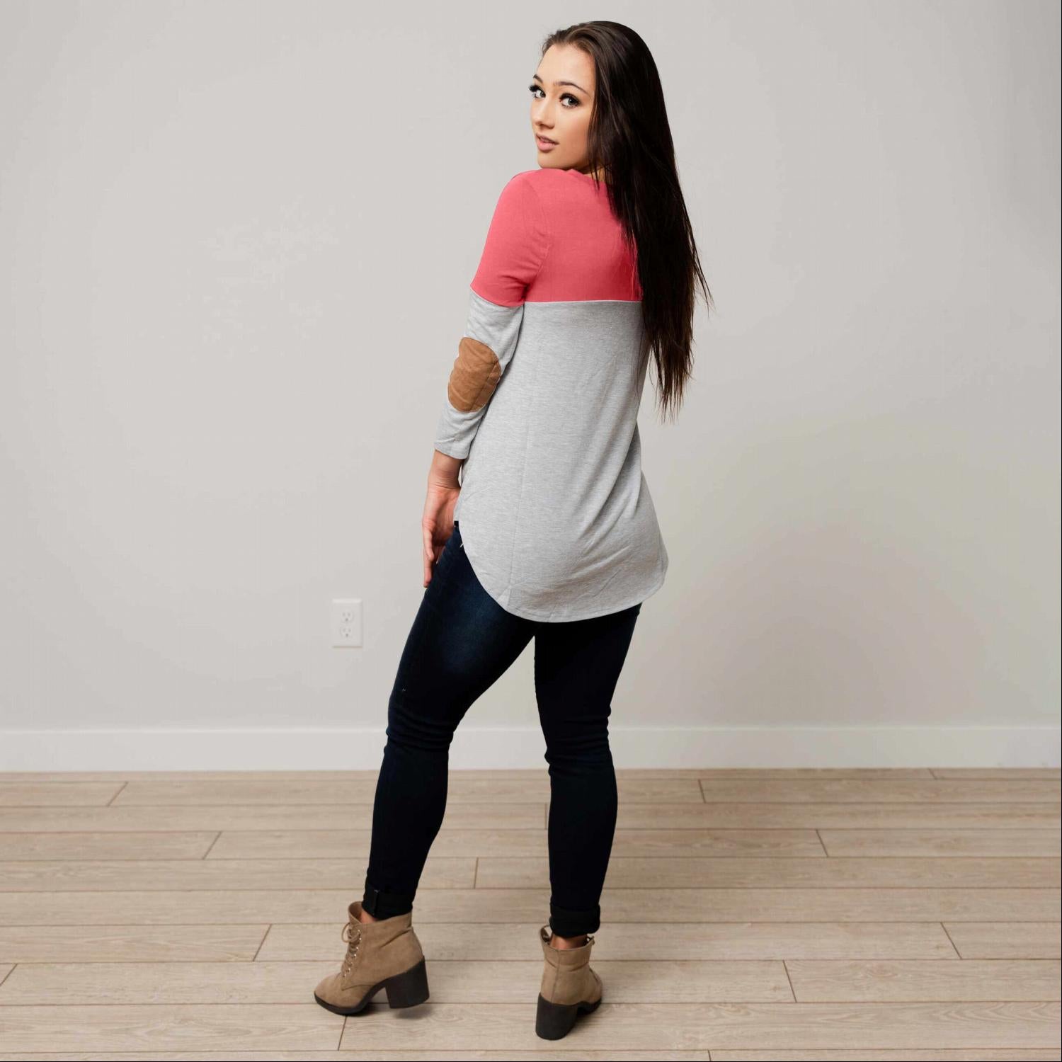 Color Blocked Suede Patch Top featuring three-quarter sleeves, suede elbow patches, and a rounded hemline in a stylish design.