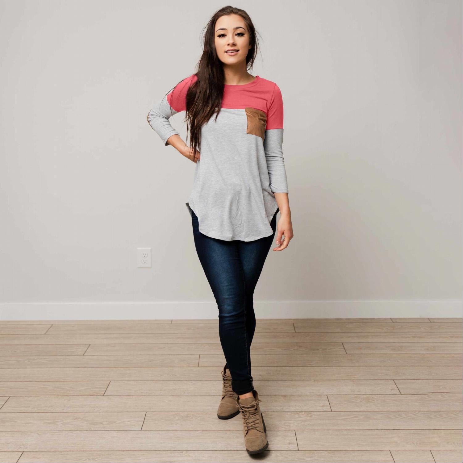 Color Blocked Suede Patch Top featuring three-quarter sleeves, suede elbow patches, and a rounded hemline in a stylish design.