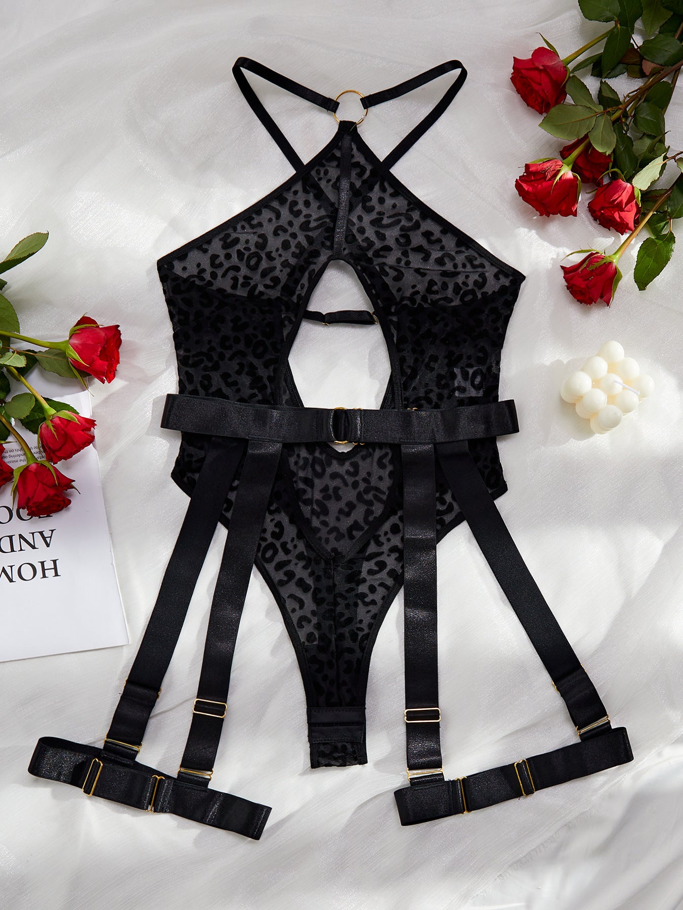 A stylish leopard print mesh bodysuit featuring sexy cutout designs and a cross backless style, perfect for enhancing allure.