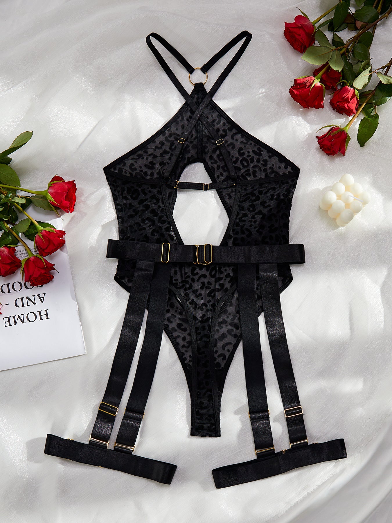 A stylish leopard print mesh bodysuit featuring sexy cutout designs and a cross backless style, perfect for enhancing allure.