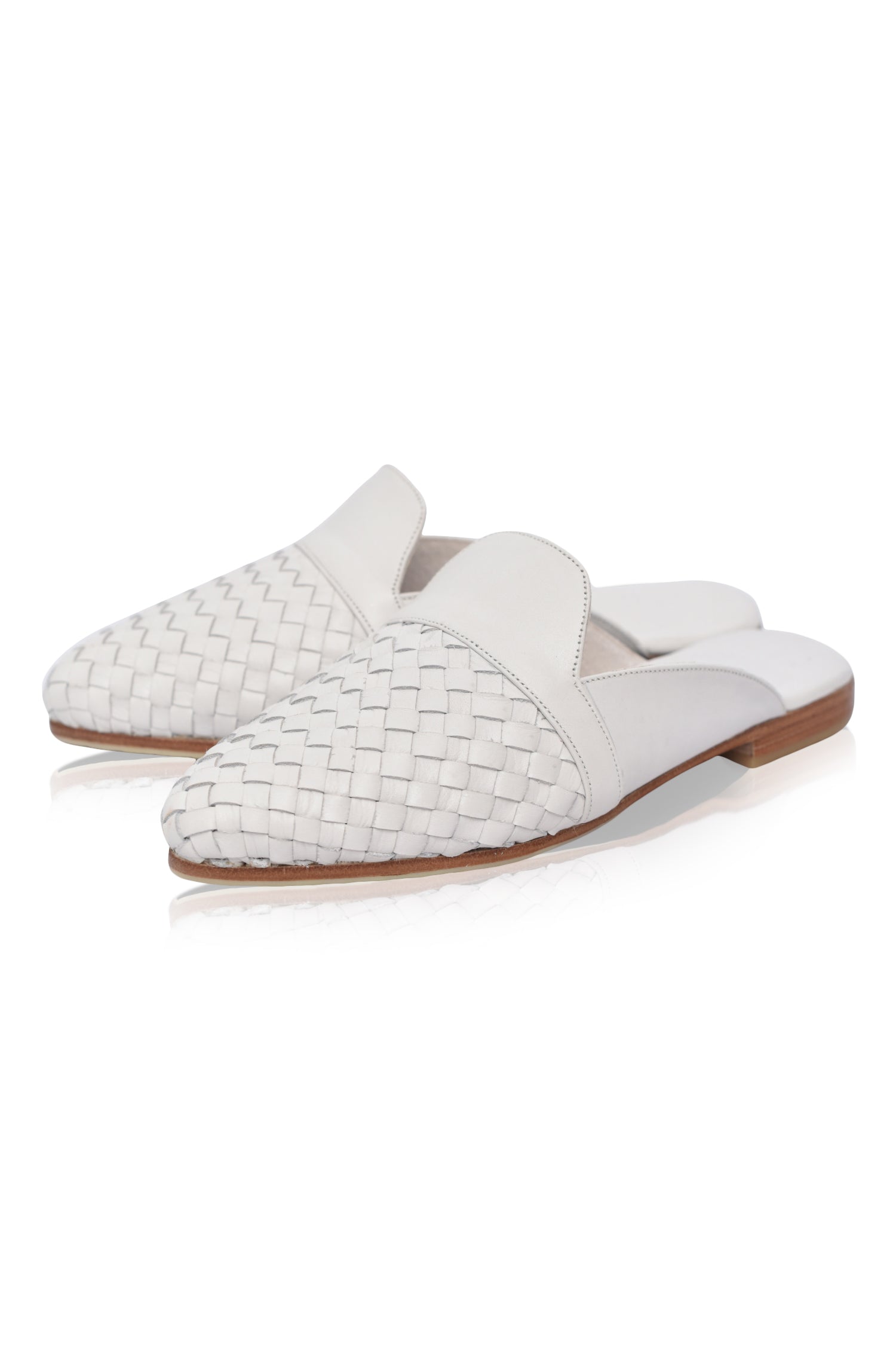 Como Leather Slides featuring a pointy toe design with a woven upper, crafted from genuine leather for a chic and sophisticated look.