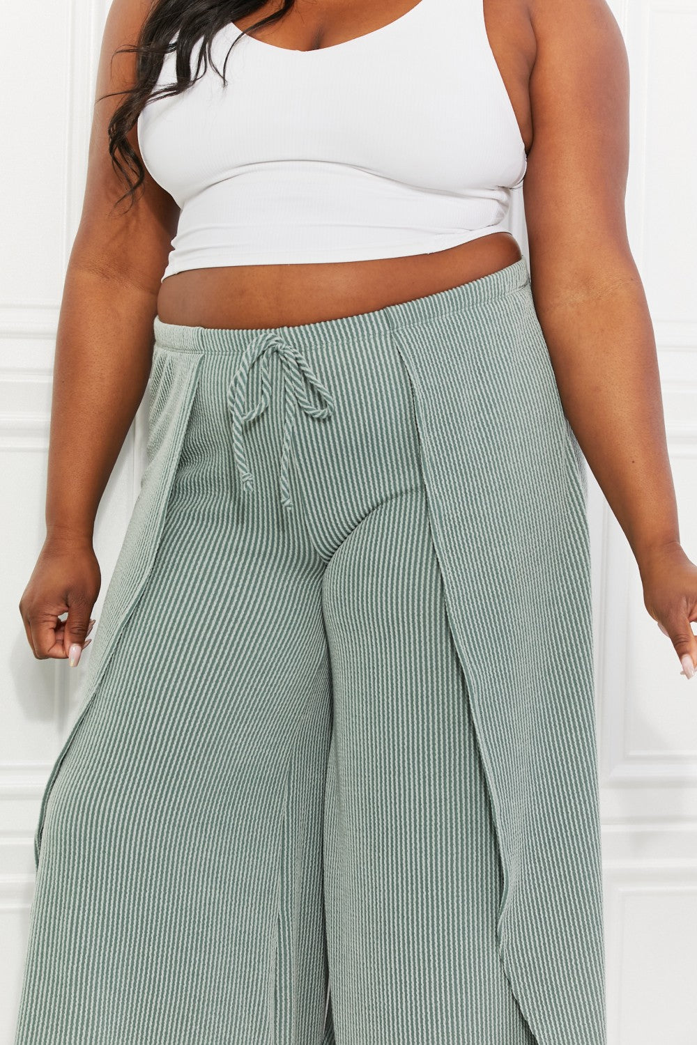 Confidently Chic Full Size Split Wide Leg Pants in Sage, featuring a stylish split-leg design and high waist for a chic summer look.