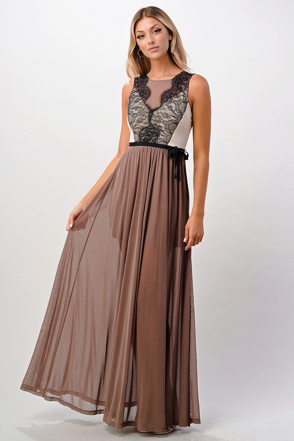 A beautiful Contrast Lace Overlap Maxi Dress featuring intricate lace detailing and a flattering silhouette, modeled by a woman standing elegantly.