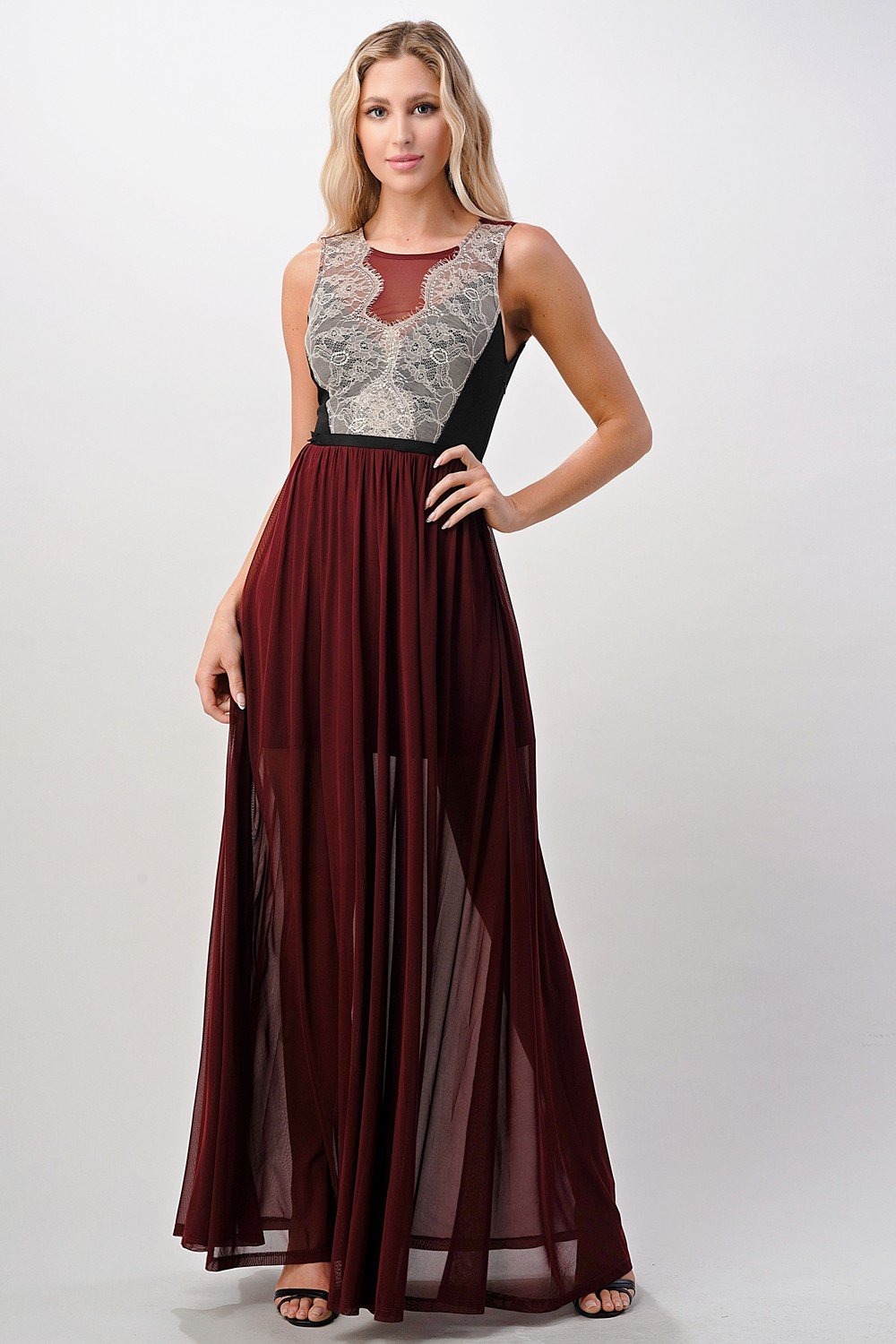 A beautiful Contrast Lace Overlap Maxi Dress featuring intricate lace detailing and a flattering silhouette, modeled by a woman standing elegantly.