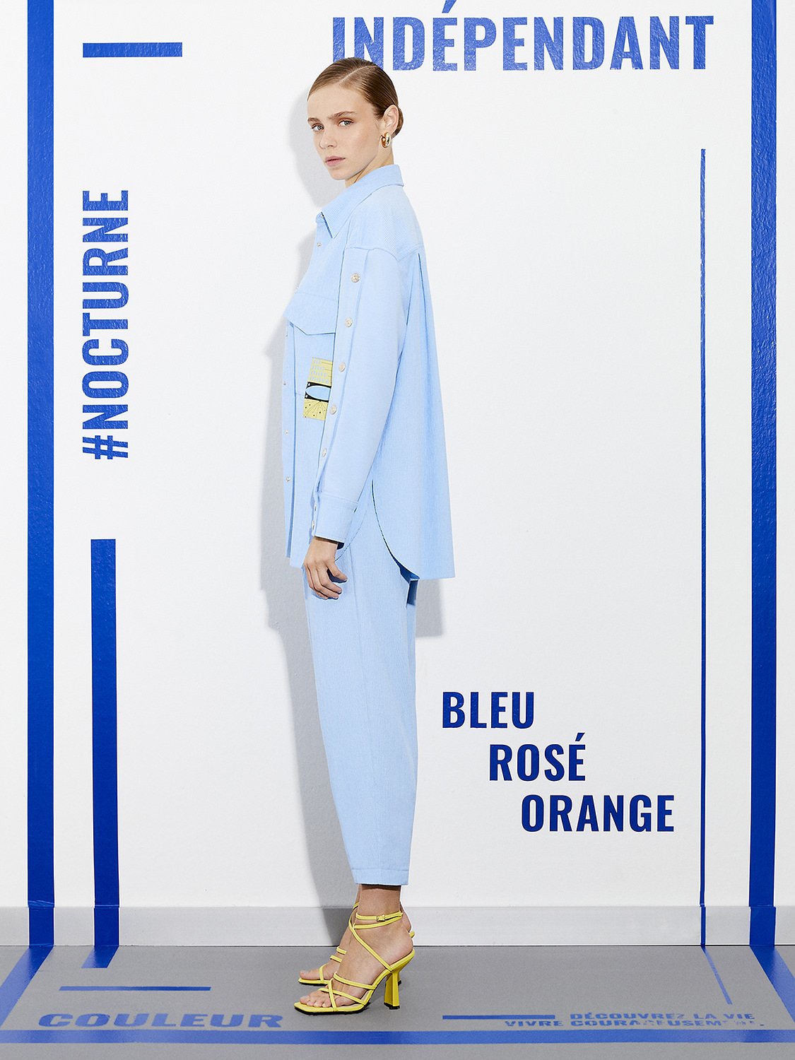 A pair of high-waisted corduroy slouchy pants in a vibrant color, featuring pleat details and side pockets.