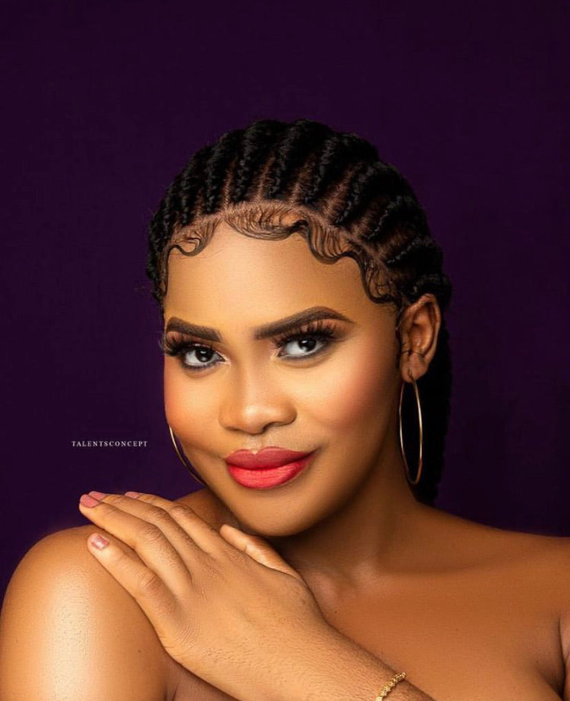 A beautifully crafted Cornrow braided wig with bleached lace, showcasing neat braids and a long 35-inch length.