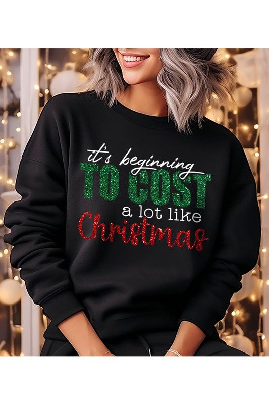 Cost Like Christmas Fleece Sweatshirt featuring a festive graphic, oversized fit, and long sleeves, perfect for holiday wear.