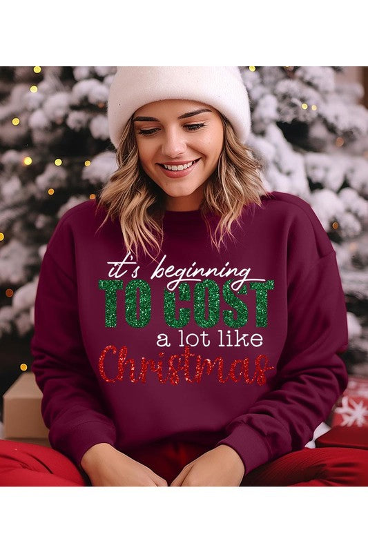 Cost Like Christmas Fleece Sweatshirt featuring a festive graphic, oversized fit, and long sleeves, perfect for holiday wear.