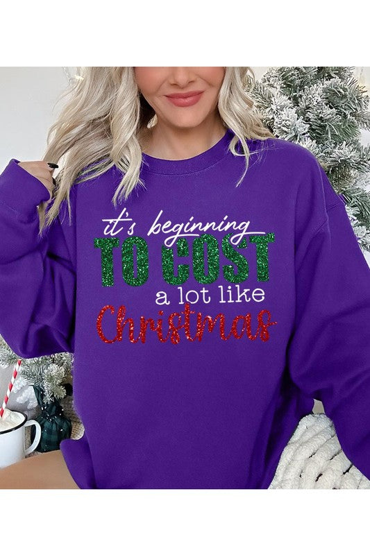 Cost Like Christmas Fleece Sweatshirt featuring a festive graphic, oversized fit, and long sleeves, perfect for holiday wear.