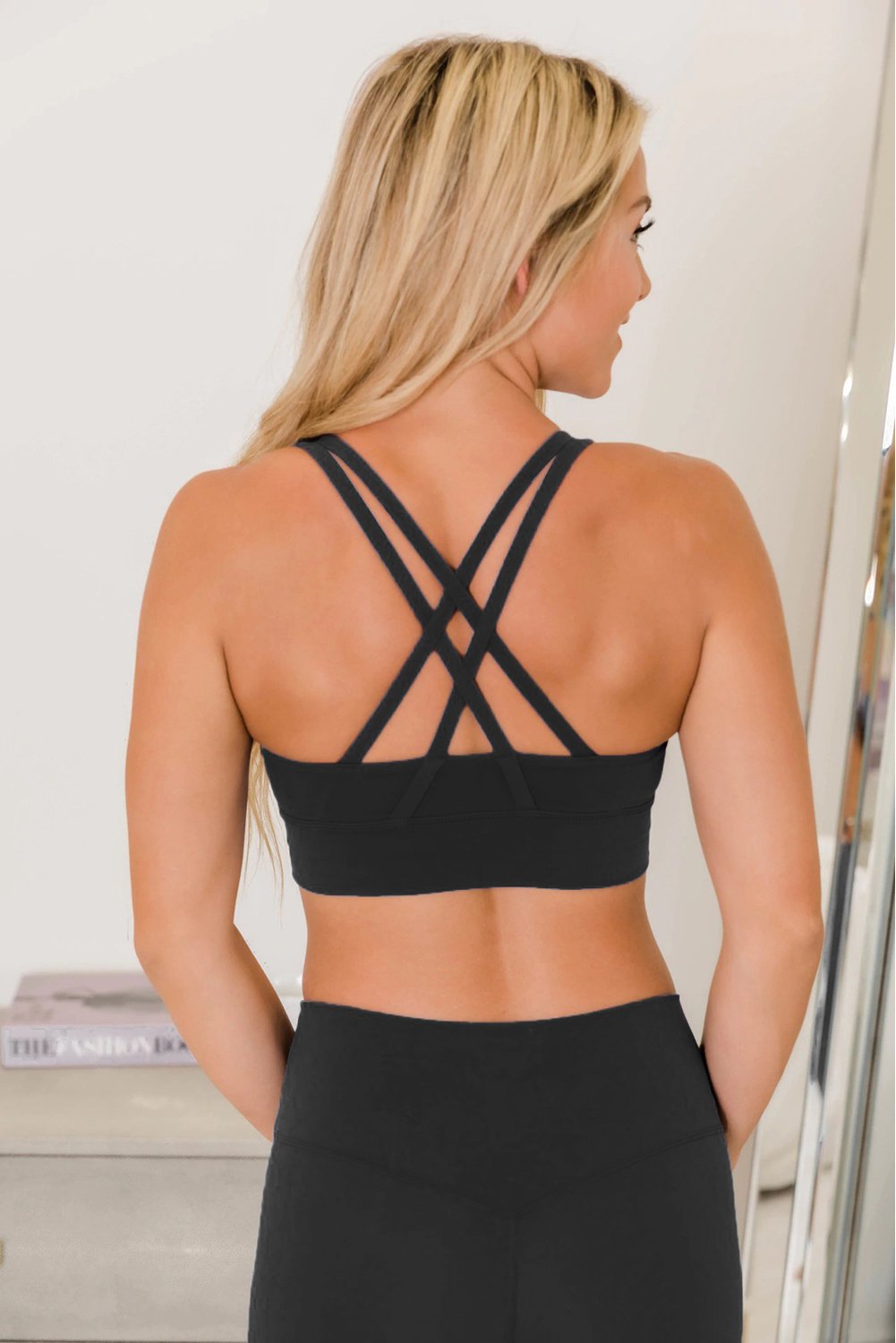 Crisscross Back Sports Bra Leggings Set in vibrant color, showcasing the stylish design and comfortable fit.