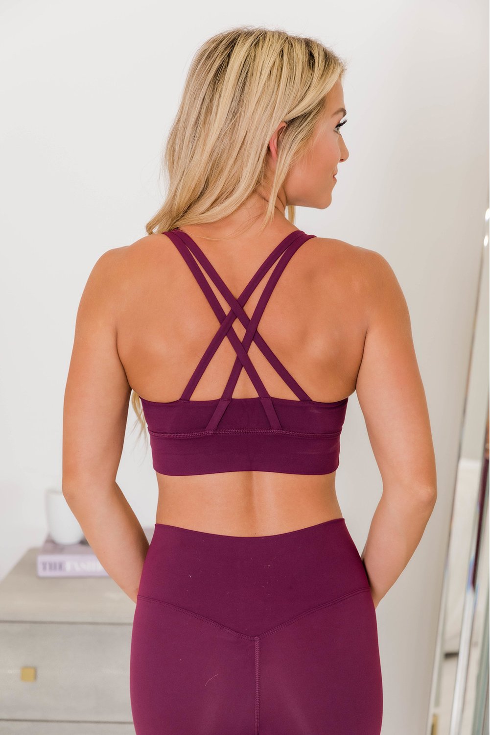 Crisscross Back Sports Bra Leggings Set in vibrant color, showcasing the stylish design and comfortable fit.