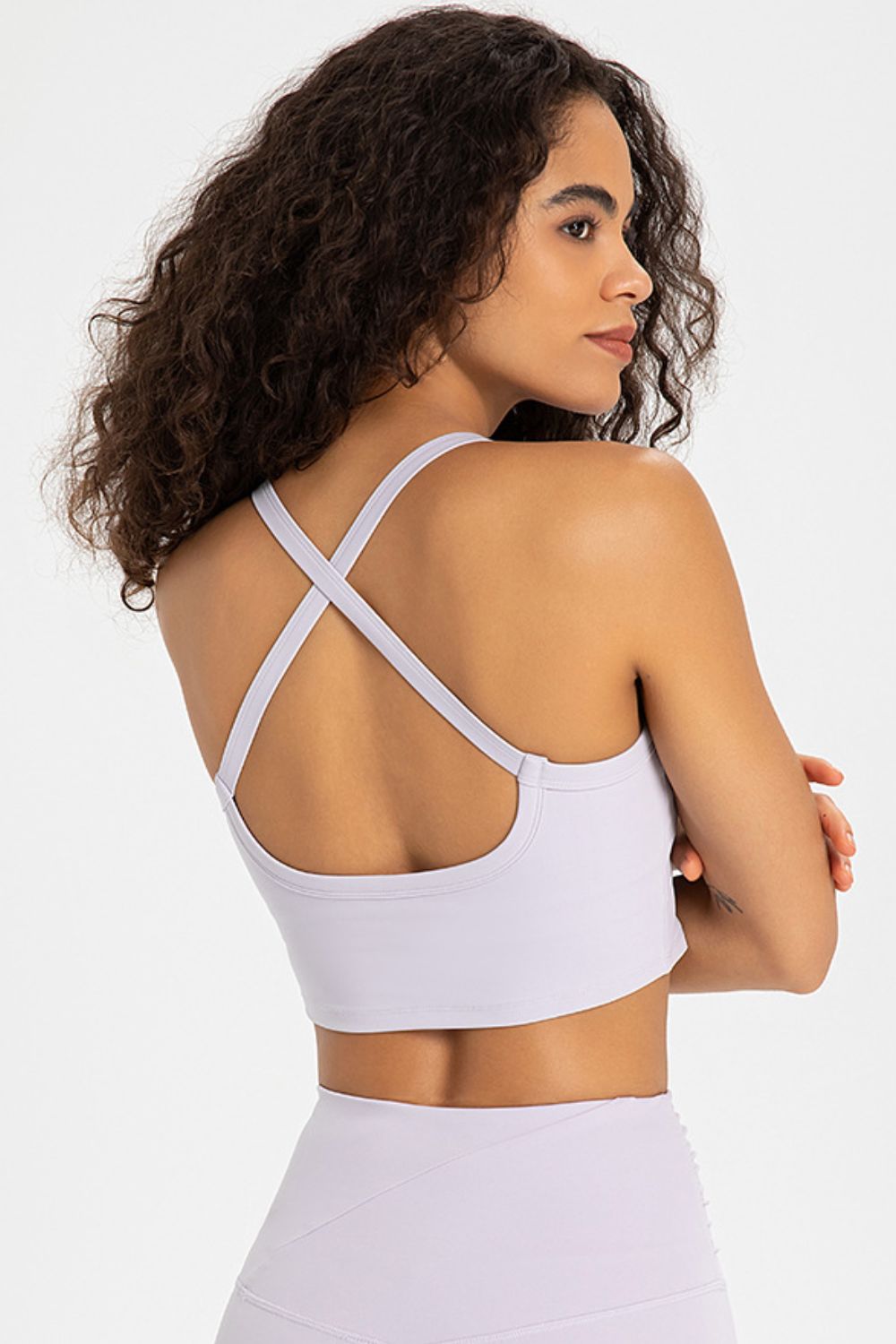 Crisscross Back V-Neck Sports Bra in solid color, featuring a stylish design and removable padding.