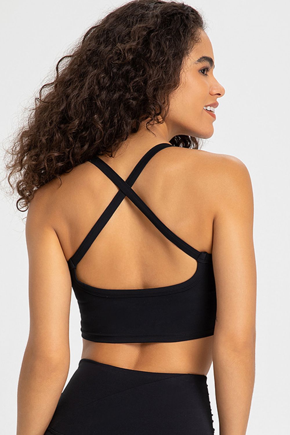 Crisscross Back V-Neck Sports Bra in solid color, featuring a stylish design and removable padding.