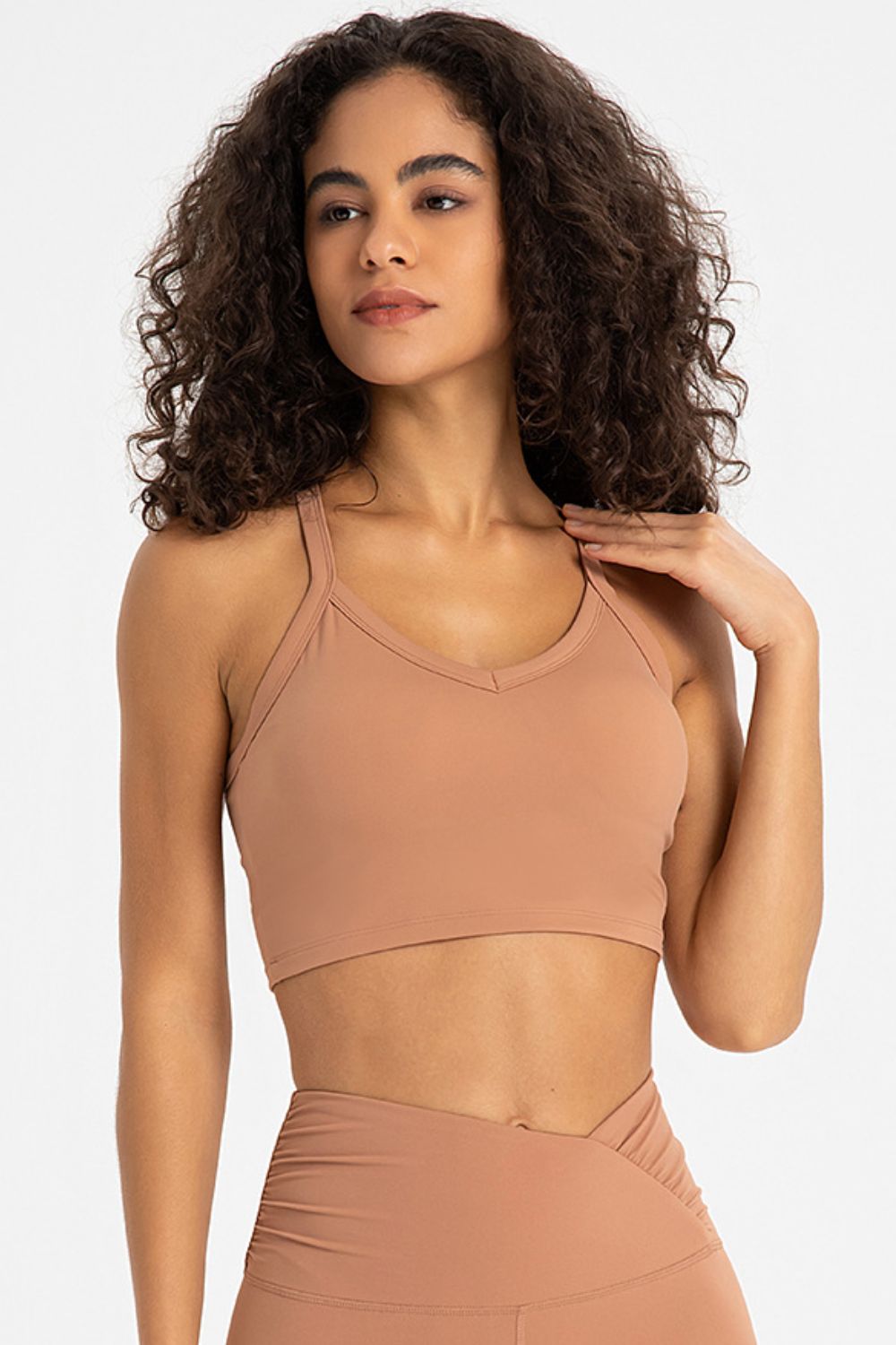 Crisscross Back V-Neck Sports Bra in solid color, featuring a stylish design and removable padding.