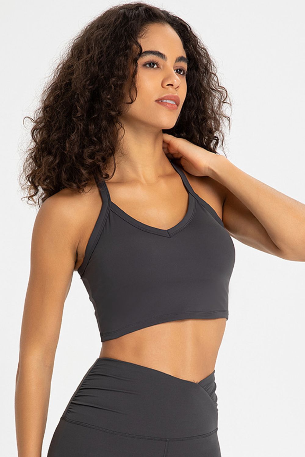 Crisscross Back V-Neck Sports Bra in solid color, featuring a stylish design and removable padding.