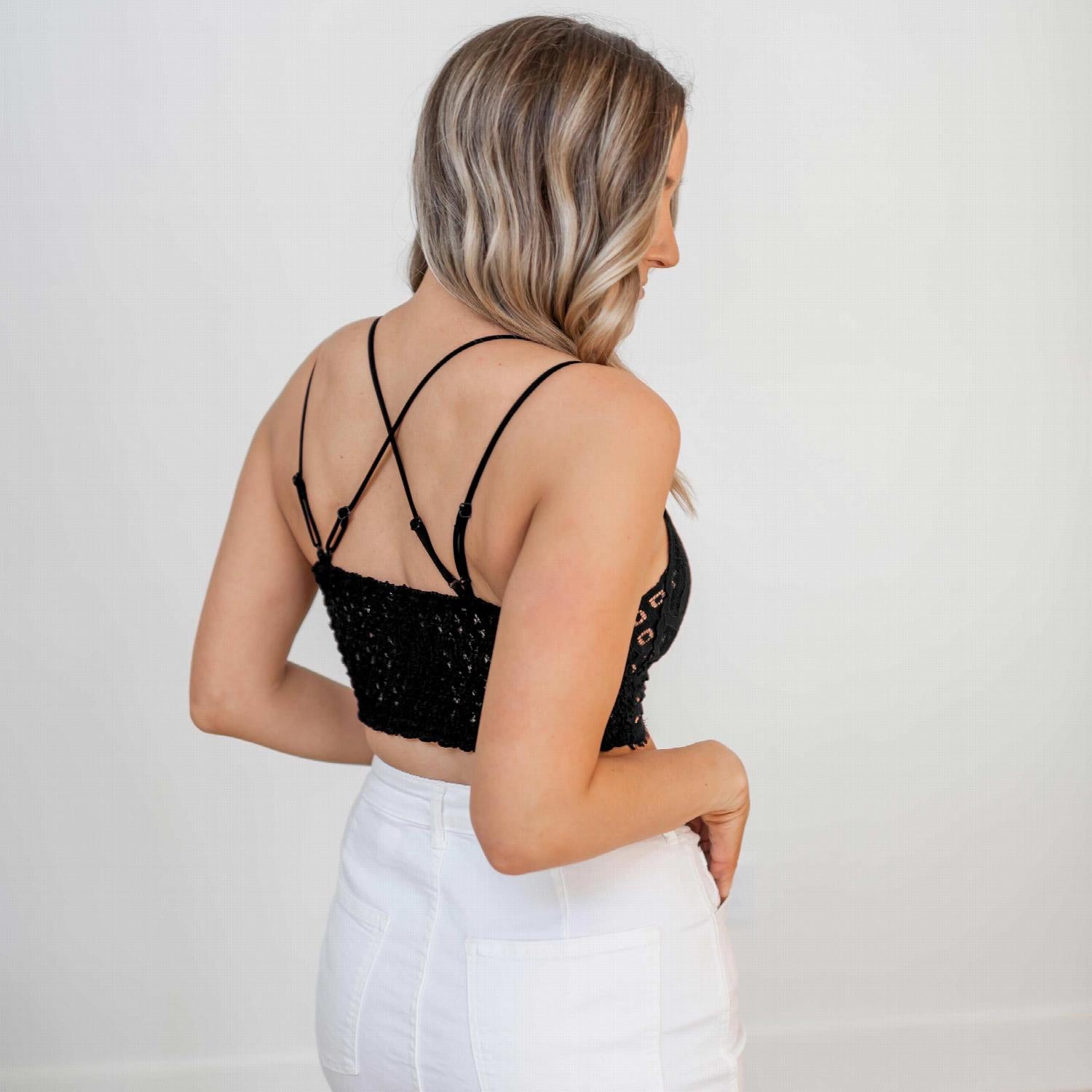 A stylish Crochet Lace Bralette with padded cups and dual shoulder straps, showcasing intricate lace detailing.