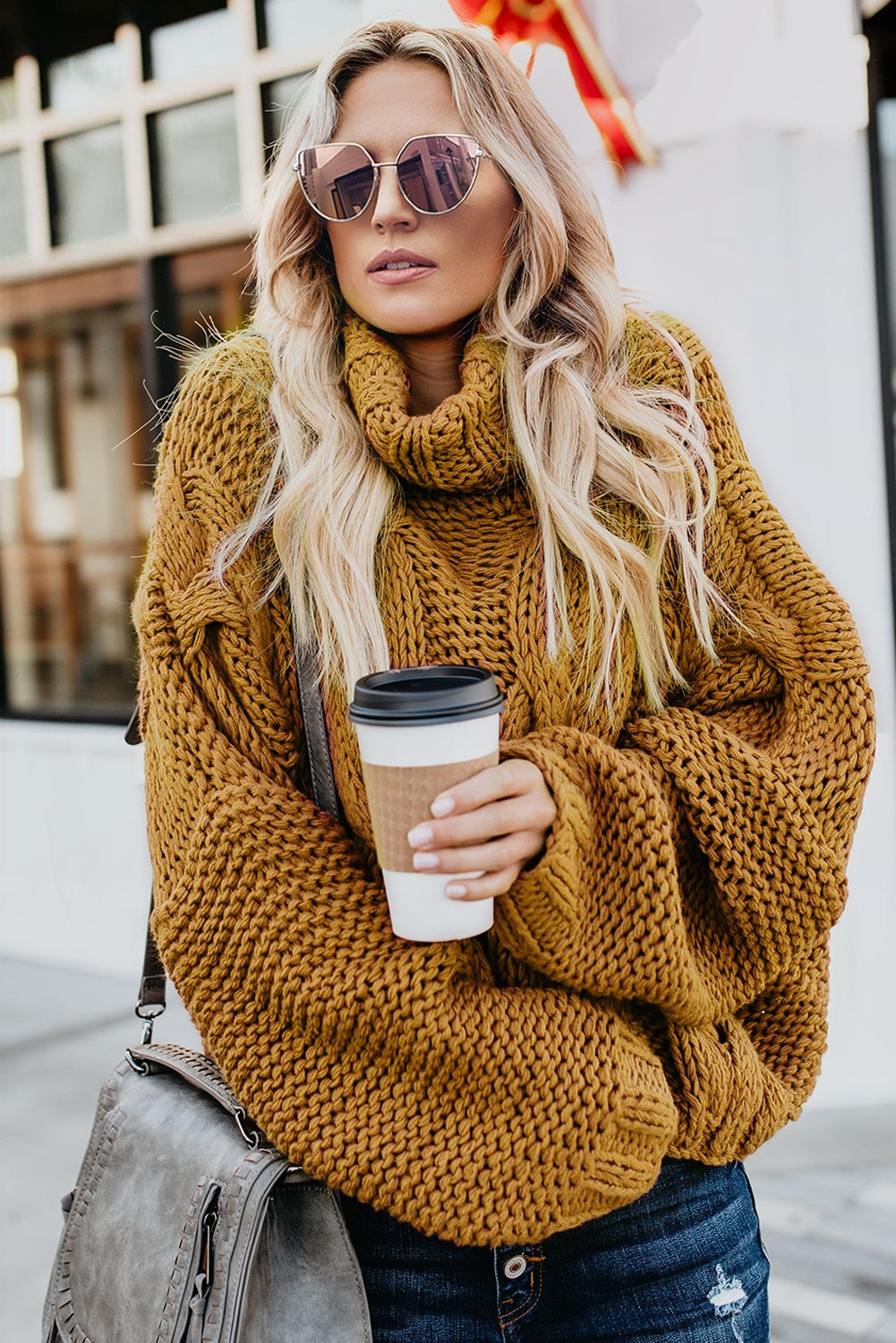 A cozy Cuddle Weather Cable Knit Handmade Turtleneck Sweater in a chunky knit design, featuring a warm turtleneck and oversized fit, perfect for winter wear.