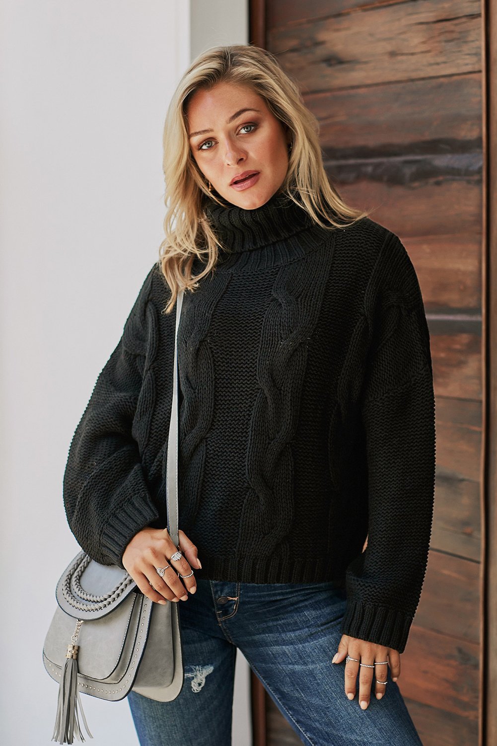 A cozy Cuddle Weather Cable Knit Handmade Turtleneck Sweater in a chunky knit design, featuring a warm turtleneck and oversized fit, perfect for winter wear.