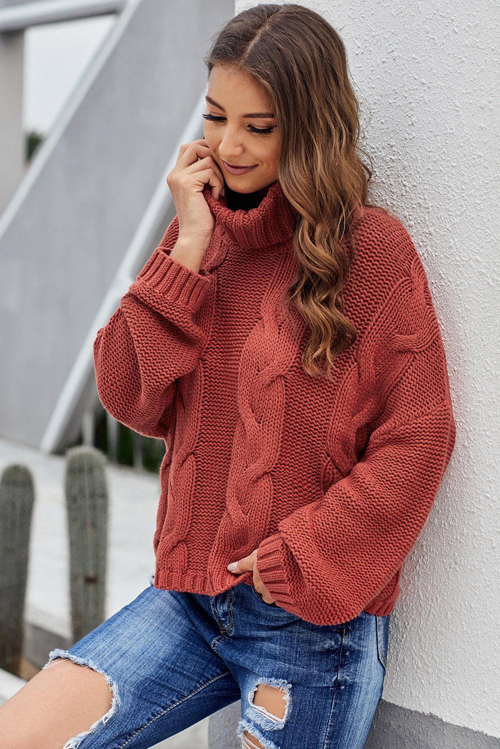 A cozy Cuddle Weather Cable Knit Handmade Turtleneck Sweater in a chunky knit design, featuring a warm turtleneck and oversized fit, perfect for winter wear.
