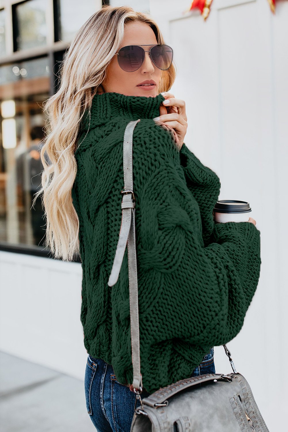 A cozy Cuddle Weather Cable Knit Handmade Turtleneck Sweater in a chunky knit design, featuring a warm turtleneck and oversized fit, perfect for winter wear.