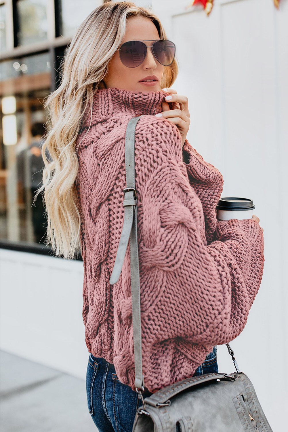 A cozy Cuddle Weather Cable Knit Handmade Turtleneck Sweater in a chunky knit design, featuring a warm turtleneck and oversized fit, perfect for winter wear.