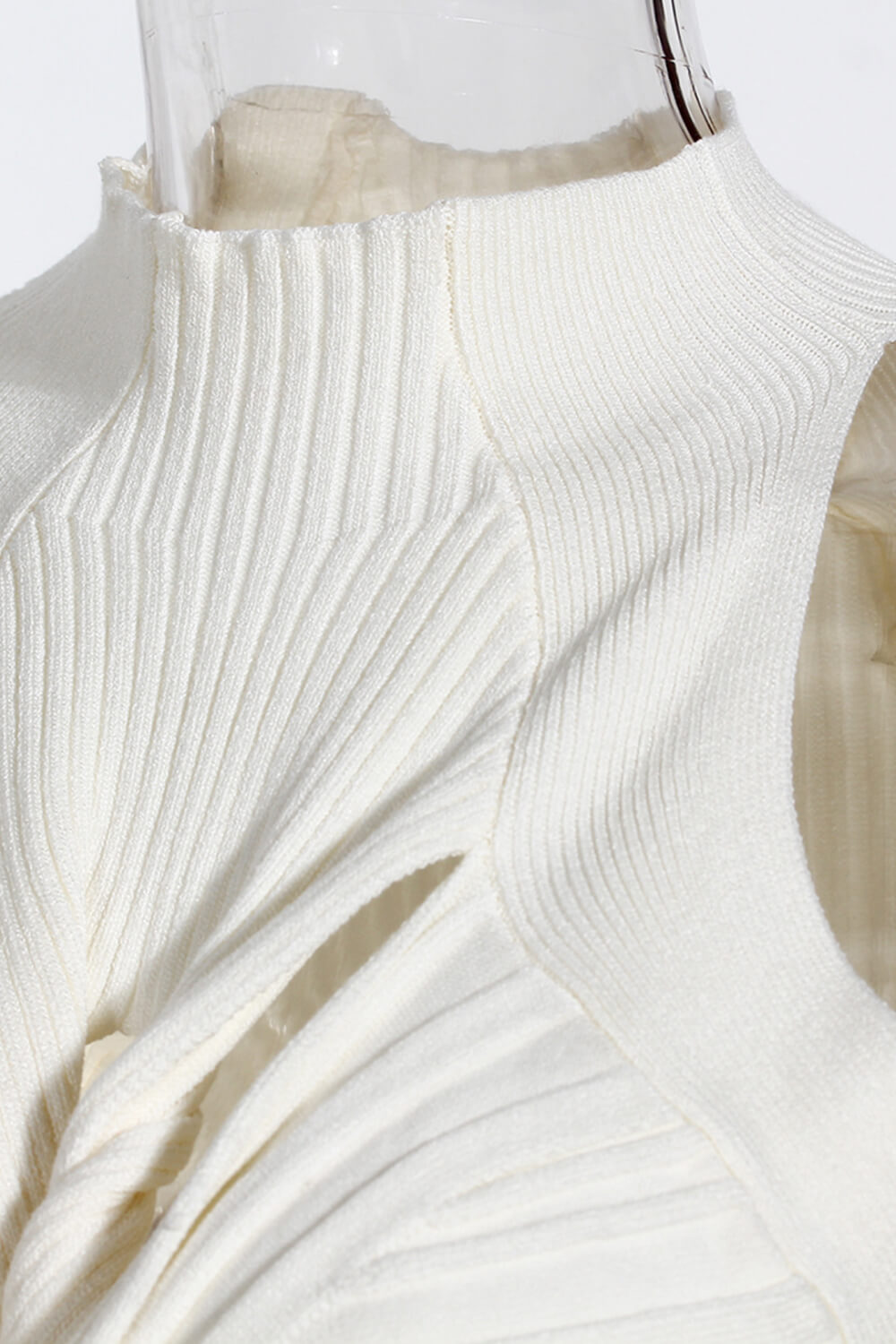 Cutout Twisted Front Sleeveless Sweater featuring a chic turtleneck and unique twisted front design, made from soft polyester.