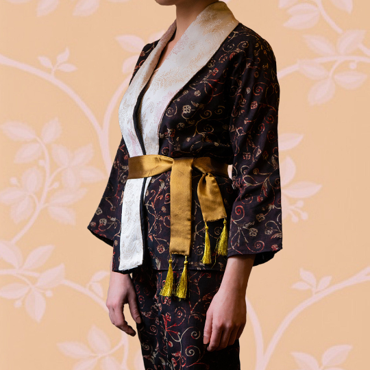 Elegant DALIA kimono jacket and pants suit featuring intricate patterns, sateen collar, and golden tassel belt.