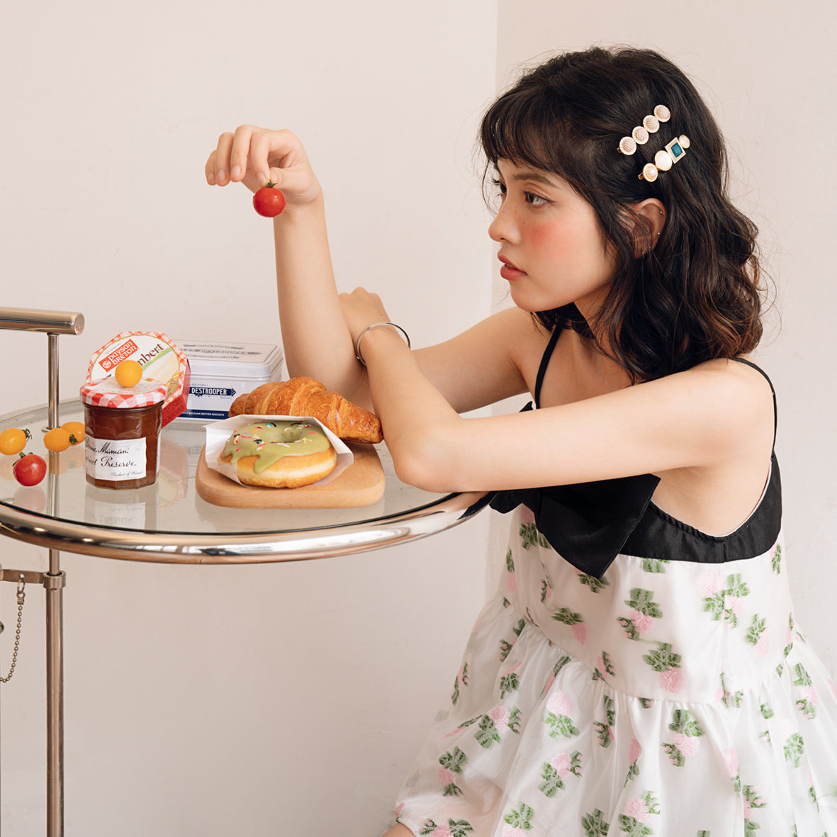 Danielle Top featuring organza chiffon fabric with floral embroidery and a large bow at the chest, elegantly styled.