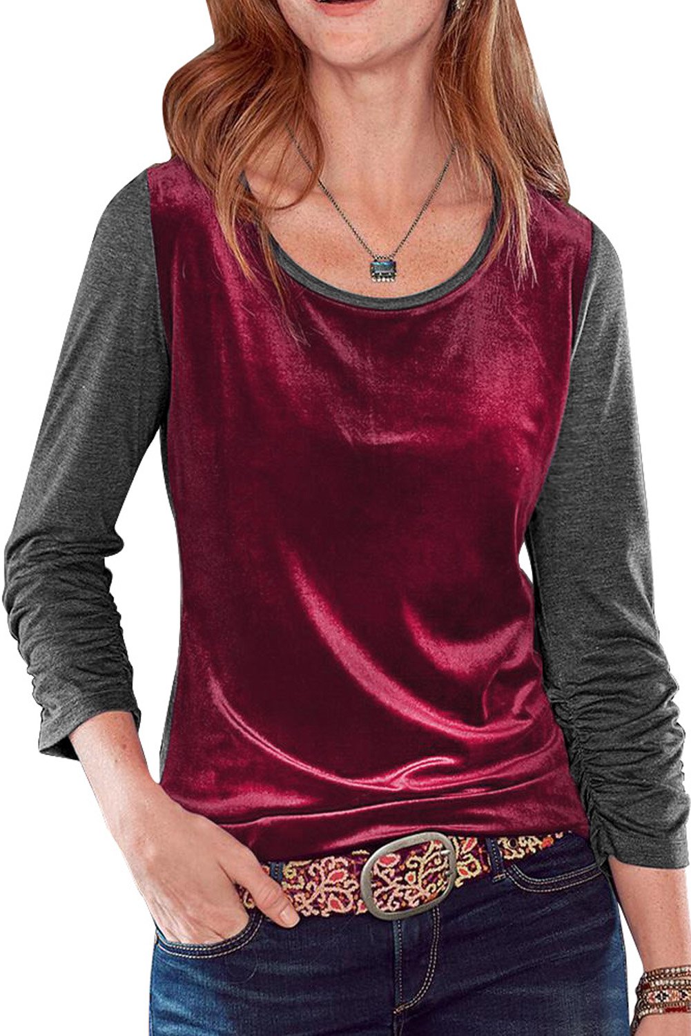 Dark blue long sleeve top with color block design and pleated cuffs, made from luxurious velvet fabric.