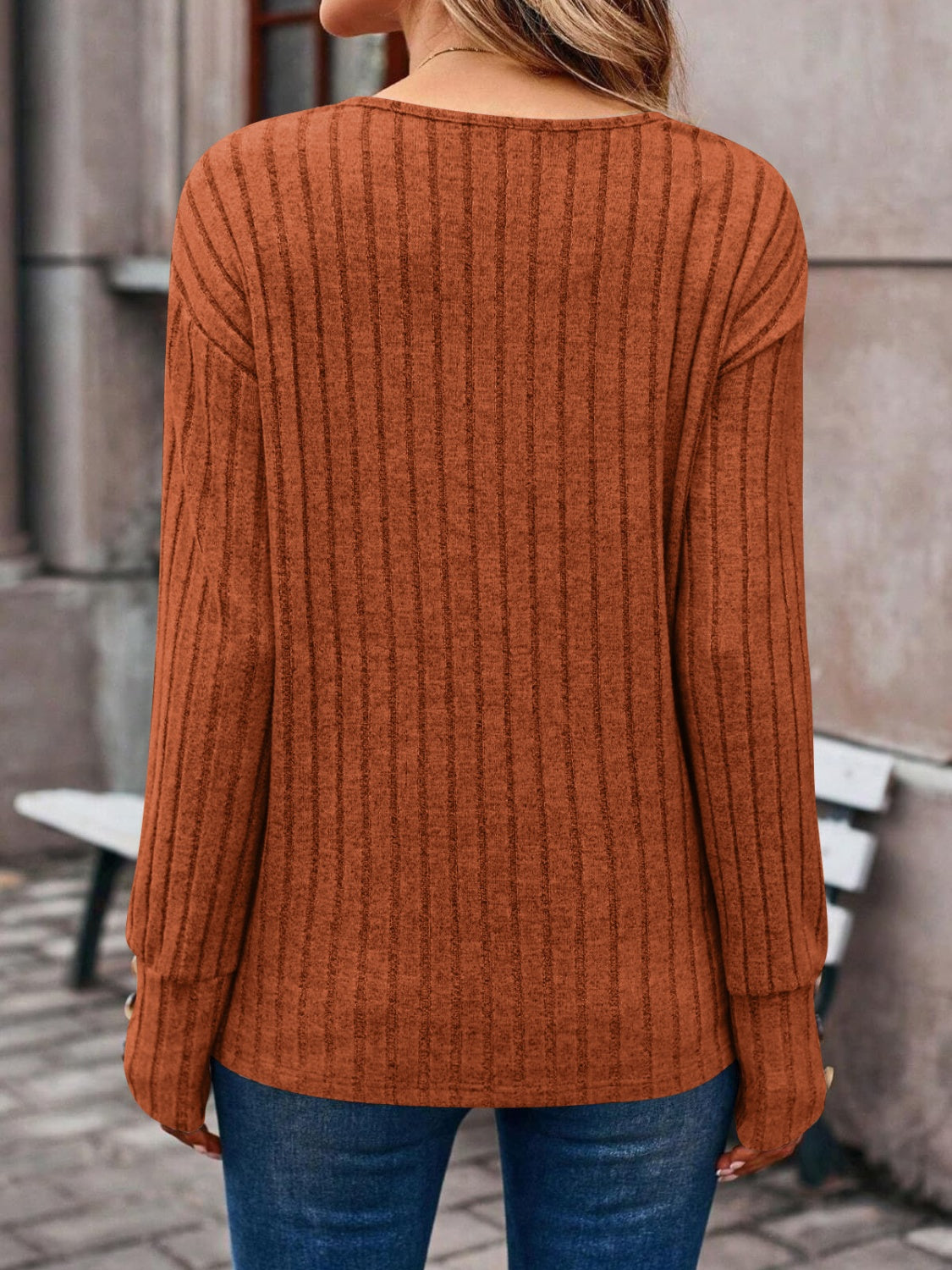 Decorative Button V-Neck Long Sleeve T-Shirt in a stylish design, showcasing its v-neckline and button details.