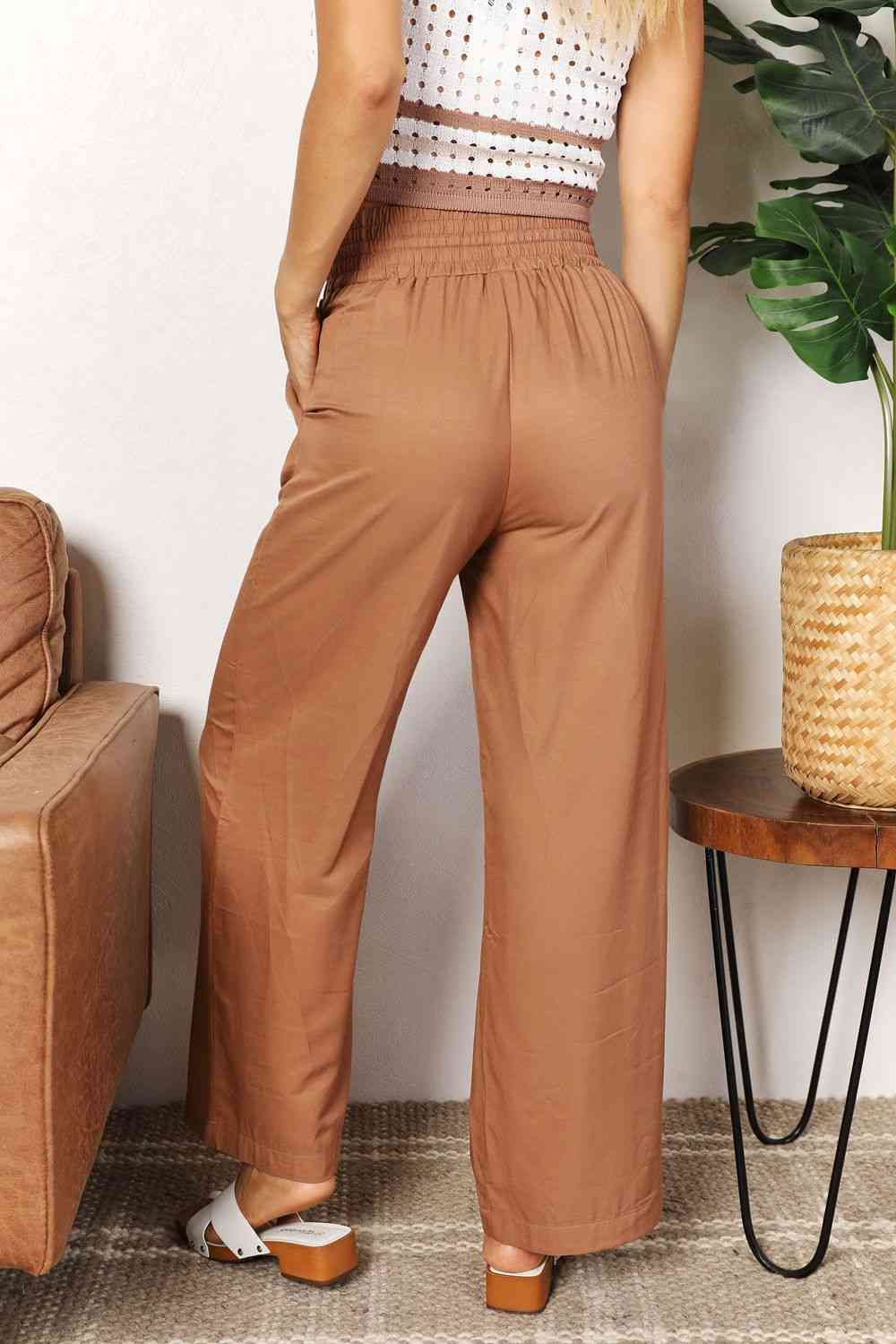Double Take Drawstring Smocked Waist Wide Leg Pants in solid color, showcasing the drawstring waist and wide leg design.