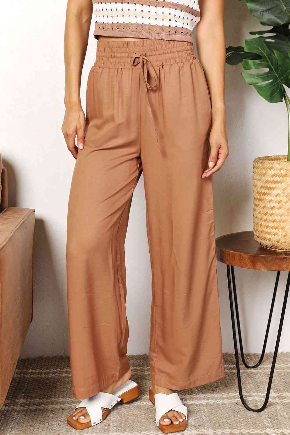 Double Take Drawstring Smocked Waist Wide Leg Pants in solid color, showcasing the drawstring waist and wide leg design.