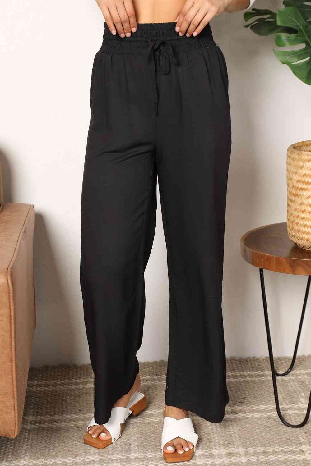 Double Take Drawstring Smocked Waist Wide Leg Pants in solid color, showcasing the drawstring waist and wide leg design.