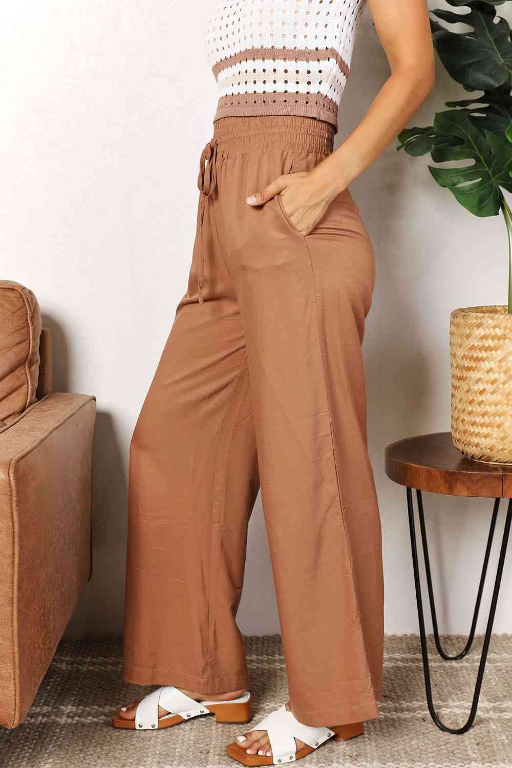 Double Take Drawstring Smocked Waist Wide Leg Pants in solid color, showcasing the drawstring waist and wide leg design.