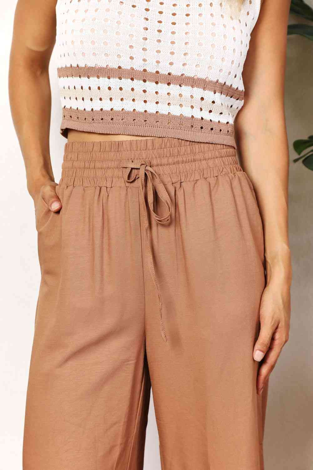 Double Take Drawstring Smocked Waist Wide Leg Pants in solid color, showcasing the drawstring waist and wide leg design.