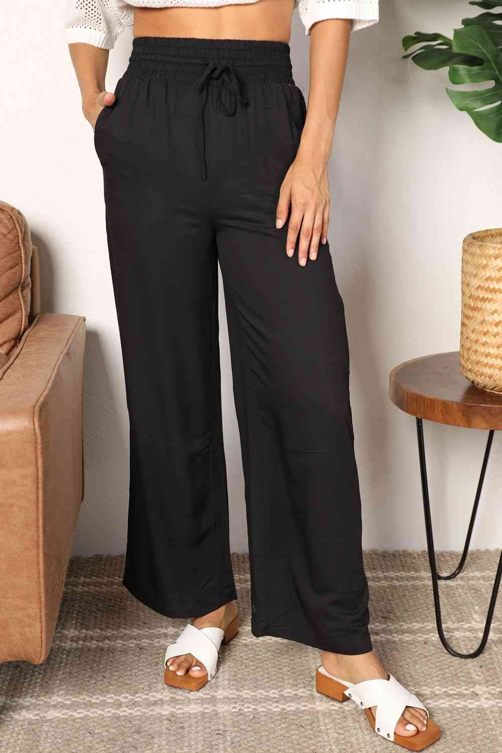 Double Take Drawstring Smocked Waist Wide Leg Pants in solid color, showcasing the drawstring waist and wide leg design.