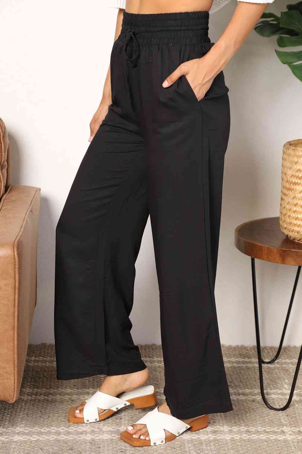 Double Take Drawstring Smocked Waist Wide Leg Pants in solid color, showcasing the drawstring waist and wide leg design.