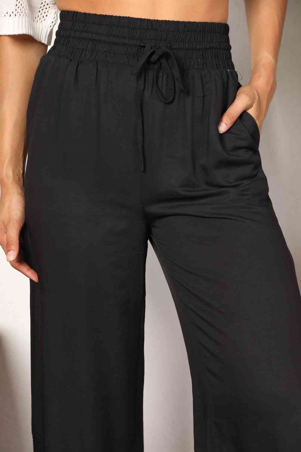 Double Take Drawstring Smocked Waist Wide Leg Pants in solid color, showcasing the drawstring waist and wide leg design.