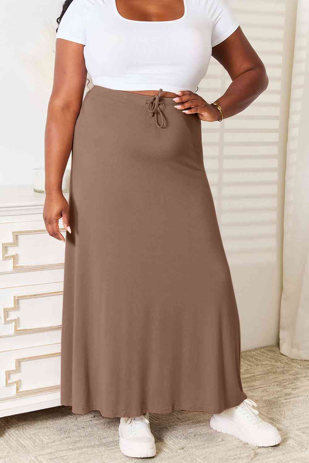 A stylish Double Take Full Size Soft Rayon Drawstring Waist Maxi Skirt in a flowing design, showcasing its adjustable drawstring waist and soft fabric.