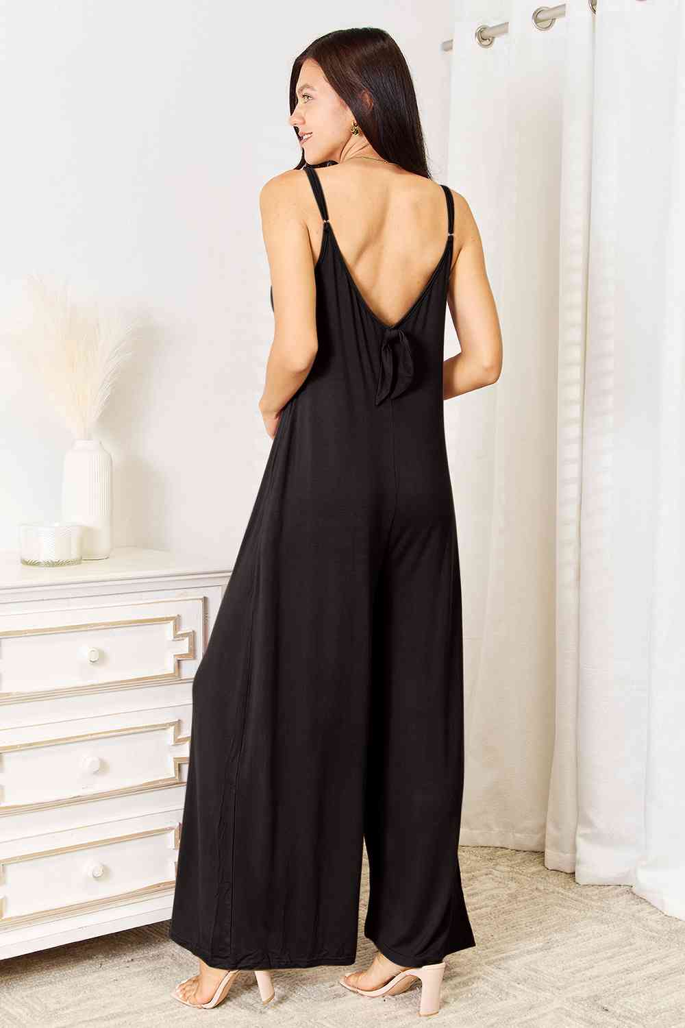 Double Take Full Size Soft Rayon Spaghetti Strap Tied Wide Leg jumpsuit in a stylish design, featuring spaghetti straps and a tied waist detail.
