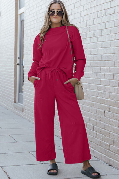 Double Take Full Size Textured Long Sleeve Top and Drawstring Pants set in a stylish design, showcasing the texture and drawstring feature.