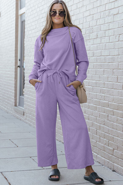 Double Take Full Size Textured Long Sleeve Top and Drawstring Pants set in a stylish design, showcasing the texture and drawstring feature.
