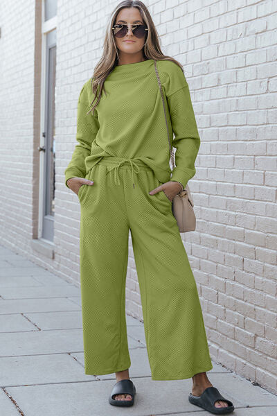 Double Take Full Size Textured Long Sleeve Top and Drawstring Pants set in a stylish design, showcasing the texture and drawstring feature.