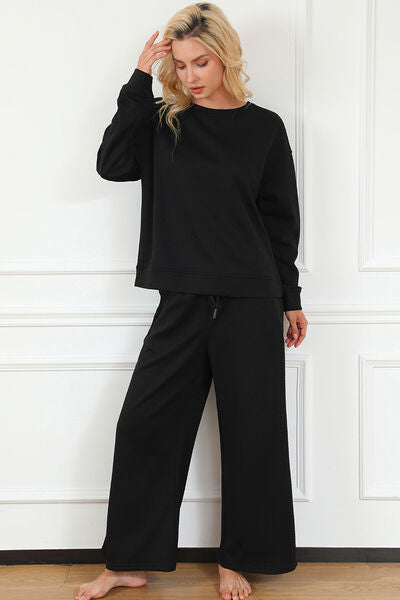 Double Take Full Size Textured Long Sleeve Top and Drawstring Pants set in a stylish design, showcasing the texture and drawstring feature.