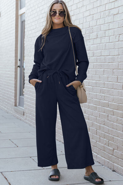 Double Take Full Size Textured Long Sleeve Top and Drawstring Pants set in a stylish design, showcasing the texture and drawstring feature.