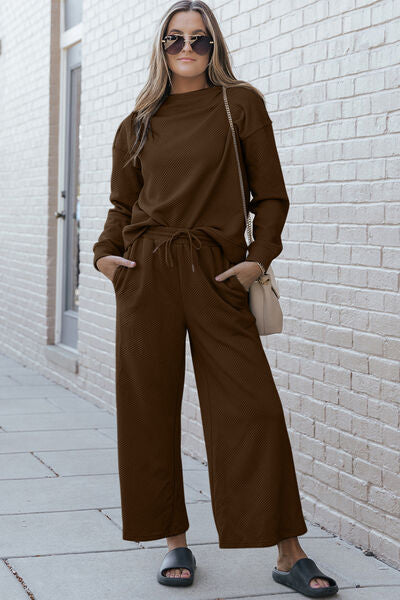 Double Take Full Size Textured Long Sleeve Top and Drawstring Pants set in a stylish design, showcasing the texture and drawstring feature.