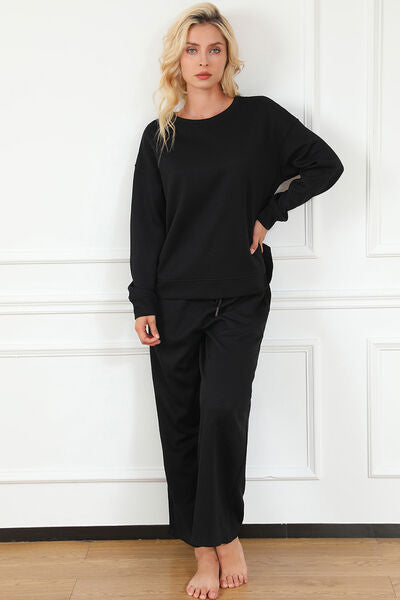 Double Take Full Size Textured Long Sleeve Top and Drawstring Pants set in a stylish design, showcasing the texture and drawstring feature.